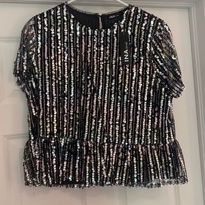 New with tags; INA Peplum sequin top.